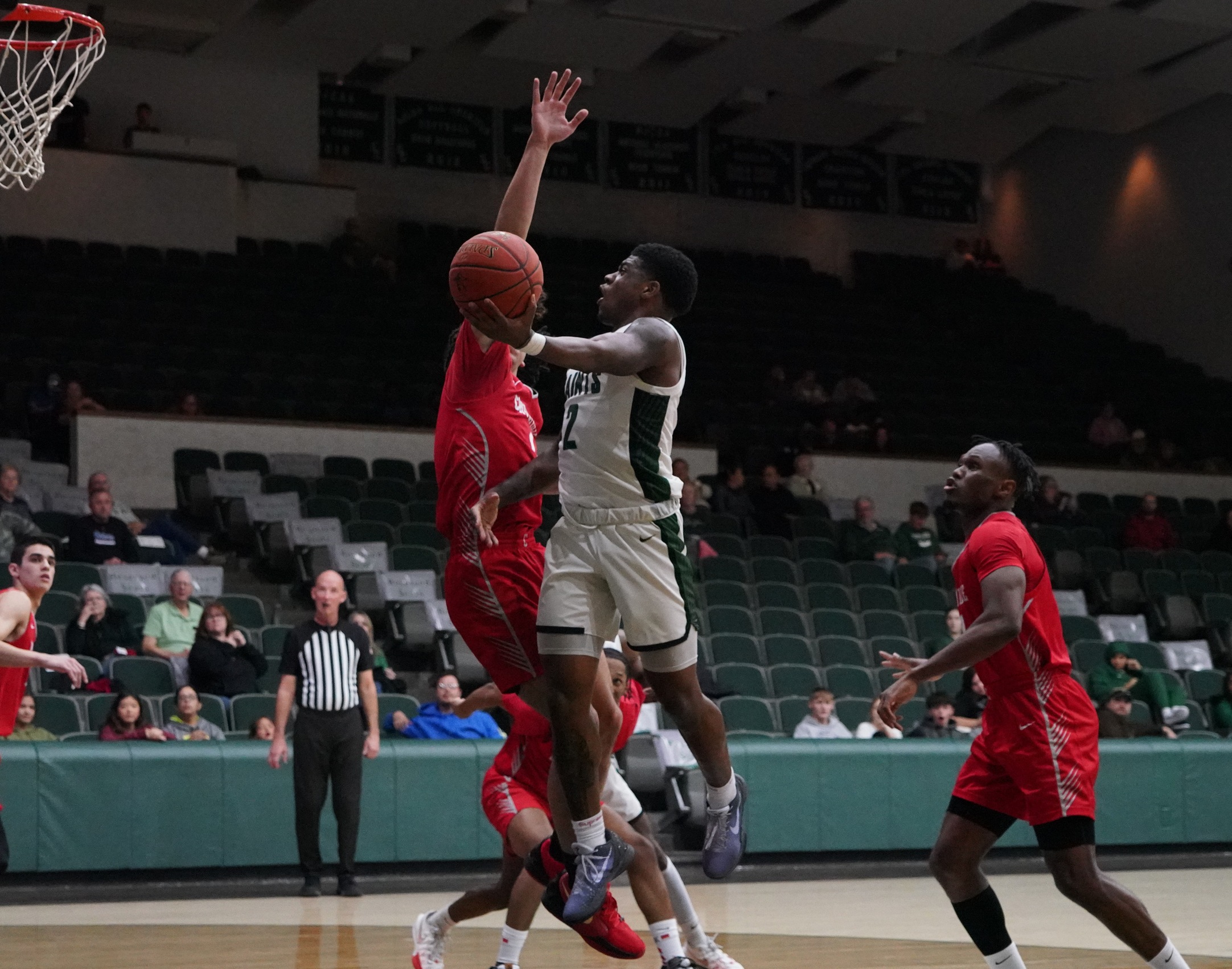 Saints battle, but fall at Hutchinson, 67-50